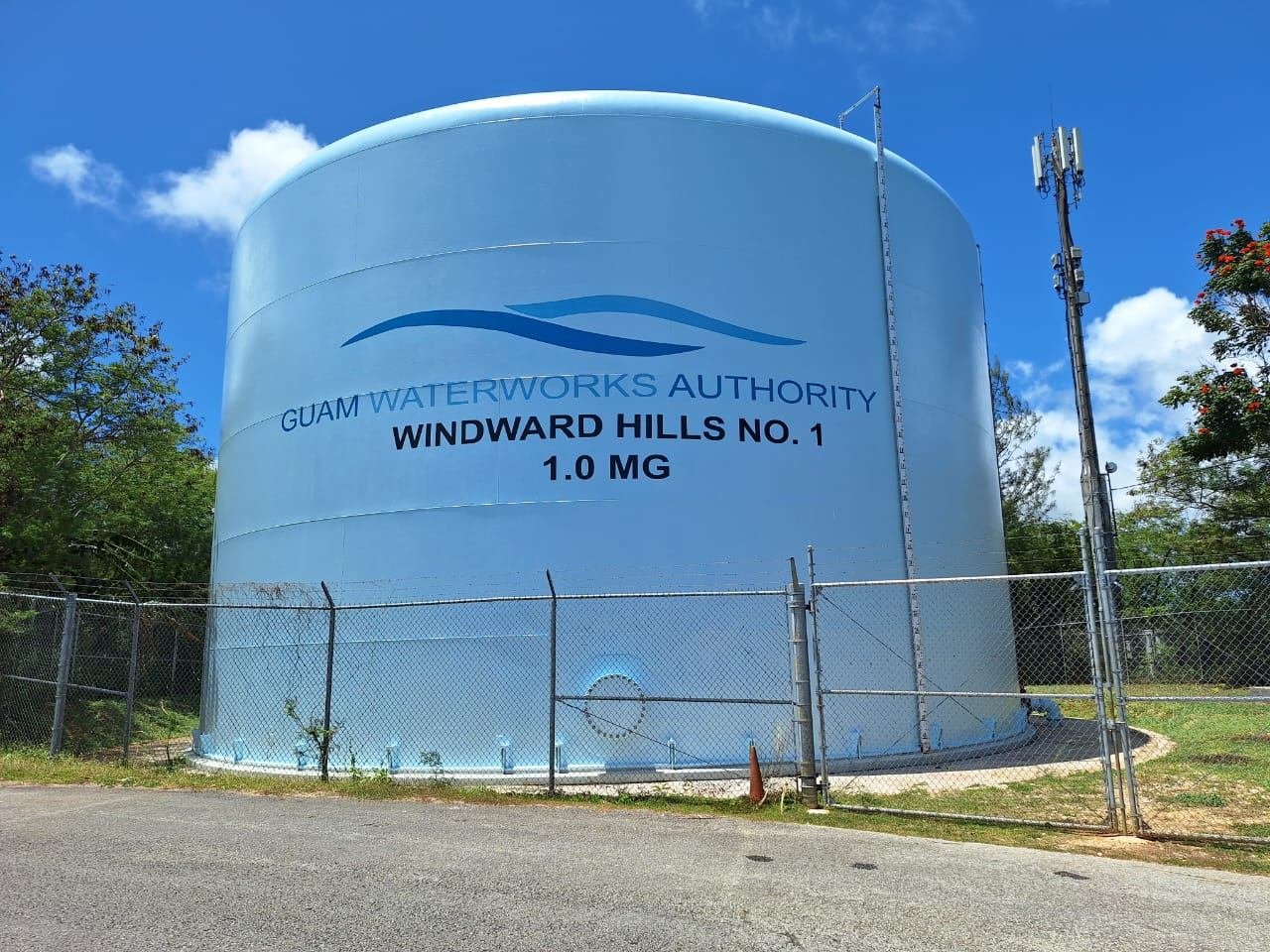 Windward Hills No. 1 tank after repair, coated blue with Guam Waterworks Authority logo